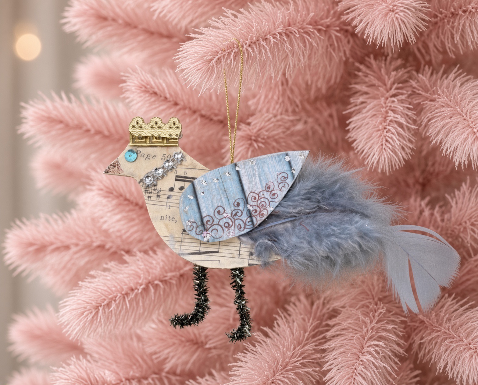 Crowned Songbird ornament on a pink tree