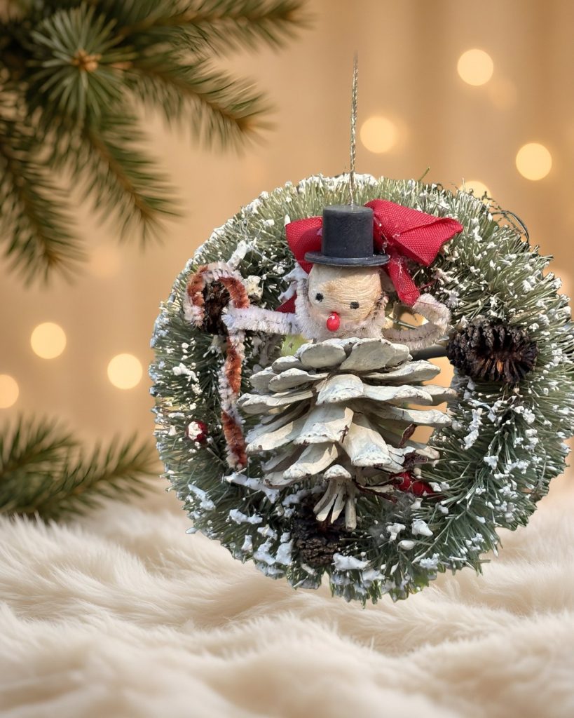 Snowman in a Snowy Wreath: Pinecone Snowman Bottle-Brush Ornament, handmade vintage Christmas ornament by Susan Jeffries